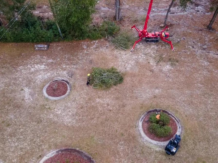 Aerial view of a commercial land clearing project by Southern Environmental using specialized heavy machinery for site preparation.
